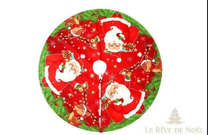 Jupe de sapin ronde rouge, motif visages du Père Noël et rennes, bordure de branches vertes