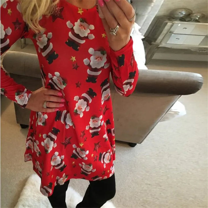 Robe de Noël moche rouge à motif Père Noël et étoiles, main posée sur la hanche