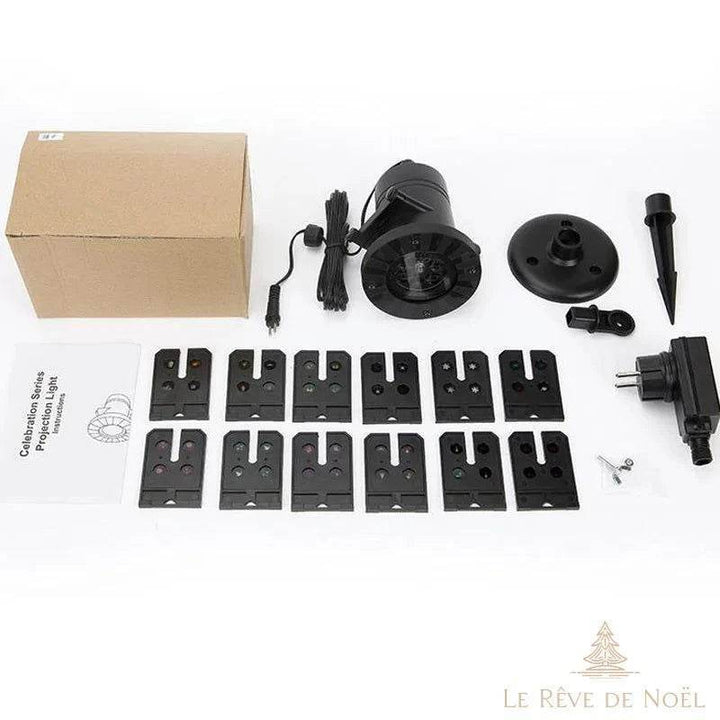Projecteur sapin de Noël déballé avec ses douze molettes à motifs interchangeables et sa notice