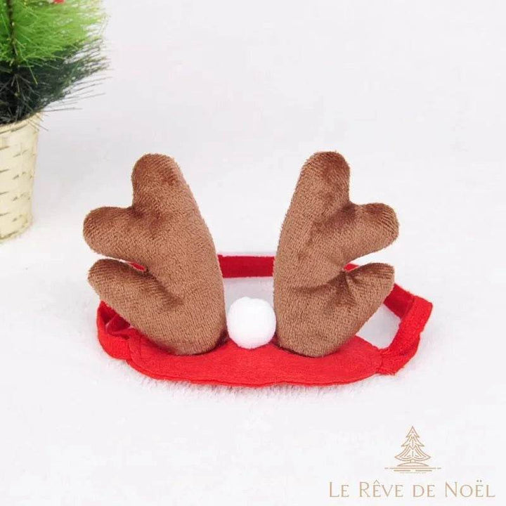 Bandeau seul avec bois de renne marron et pompon blanc, posé sur fond blanc moelleux