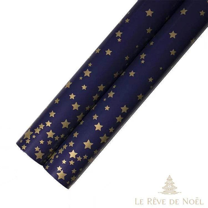 Deux rouleaux de papier cadeau bleu marine semés de petites étoiles dorées éparses