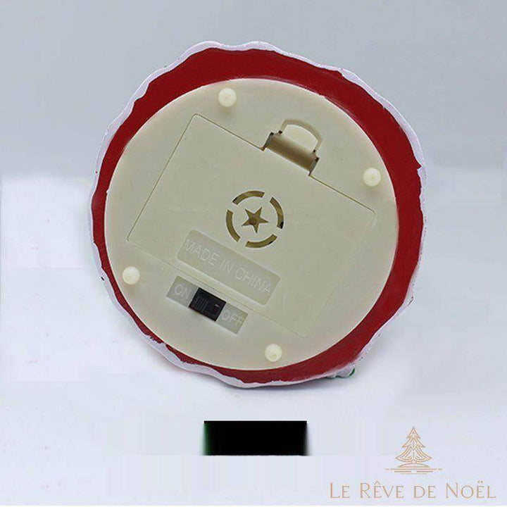 Dessous du socle de la boule à neige lumineuse : compartiment à piles avec interrupteur marche/arrêt
