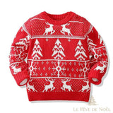 Pull enfant rouge à motif jacquard blanc : rennes, sapins et flocons, vue à plat de face