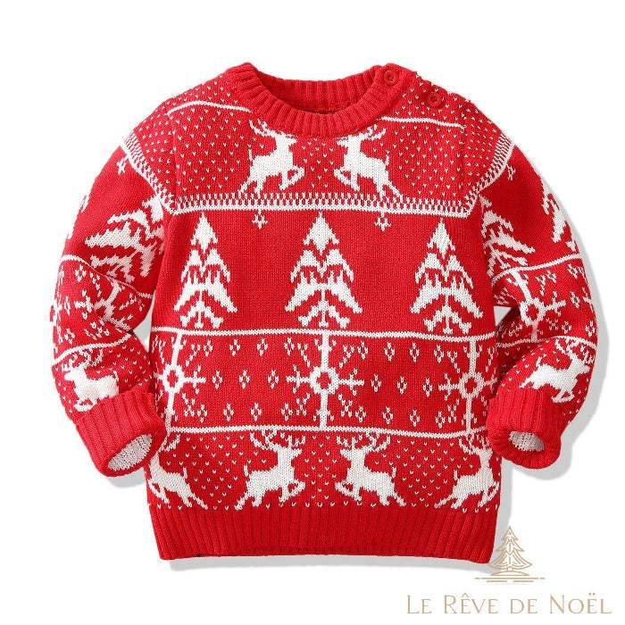 Pull enfant rouge à motif jacquard blanc : rennes, sapins et flocons, vue à plat de face