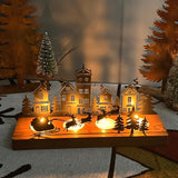 Bougeoir maison de Noël en bois avec traîneau du Père Noël, bougies allumées la nuit