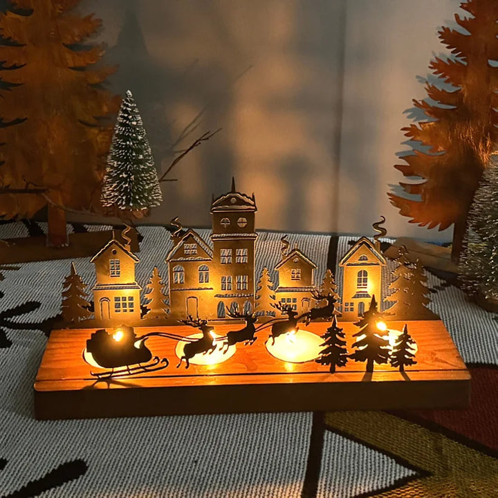 Bougeoir maison de Noël en bois avec traîneau du Père Noël, bougies allumées la nuit
