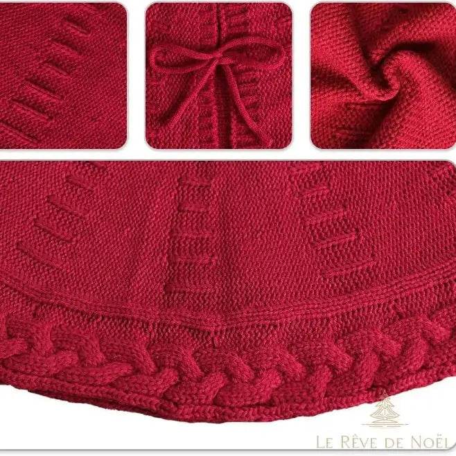Gros plan sur le tricot rouge : maille à jours, nœud du lien et bordure torsadée