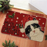 Tapis d'entrée rouge à pois, chat noir et blanc coiffé d'un bonnet de Père Noël, texte Meowy Christmas