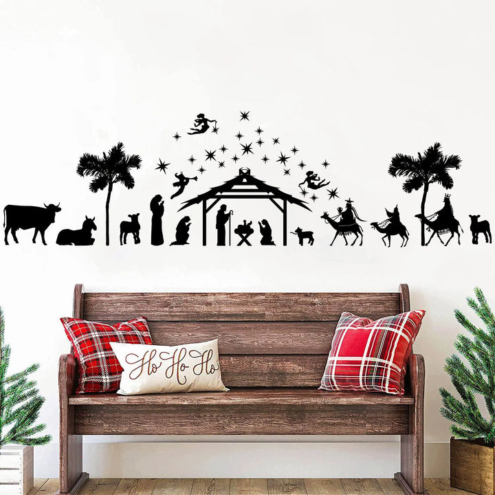 Sticker silhouette de crèche de Noël appliqué au mur au-dessus d'un banc en bois à coussins