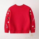 Dos du pull de Noël enfant rouge, uni avec motifs cadeaux et étoiles sur les manches