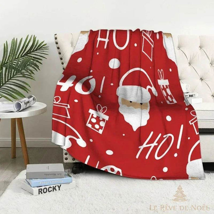 Plaid de Noël rouge avec tête de Père Noël et inscriptions « Ho Ho Ho » en blanc