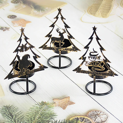 Trois bougeoirs sapin en métal noir, silhouettes Père Noël, renne et texte Joyeux Noël, sur bois