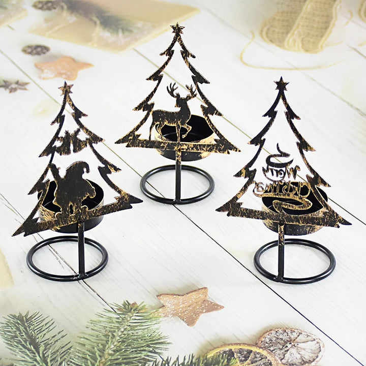 Trois bougeoirs sapin en métal noir, silhouettes Père Noël, renne et texte Joyeux Noël, sur bois