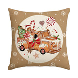 Housse de coussin beige illustrée d'un camion chargé de biscuits, sapin en pain d'épice et bonhomme de neige