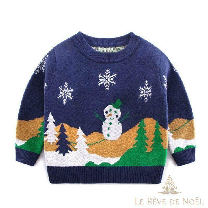 Pull de Noël enfant bleu marine à bonhomme de neige, sapins et flocons brodés, présenté à plat