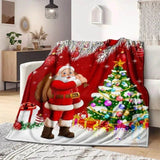 Plaid de Noël rouge posé sur un fauteuil, Père Noël portant un sac de cadeaux près du sapin