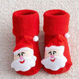 Paire de chaussettes de Noël bébé rouges, visage du Père Noël en relief, bonnet à pompon blanc