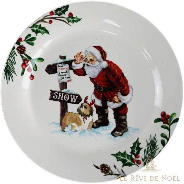 Assiette bordée de houx, Père Noël accoudé à un panneau SNOW à côté d'un bouledogue