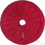 Cache-pied de sapin en tricot rouge vu de dessus, bordure torsadée et fente à nouer