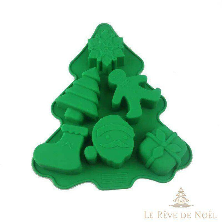 Gros plan sur le petit moule à six empreintes de Noël : flocon, sapin, bonhomme, botte, Père Noël, cadeau