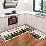 Tapis à bordure à carreaux noir et blanc, sapins verts et rouges, posés devant une cuisinière à gaz
