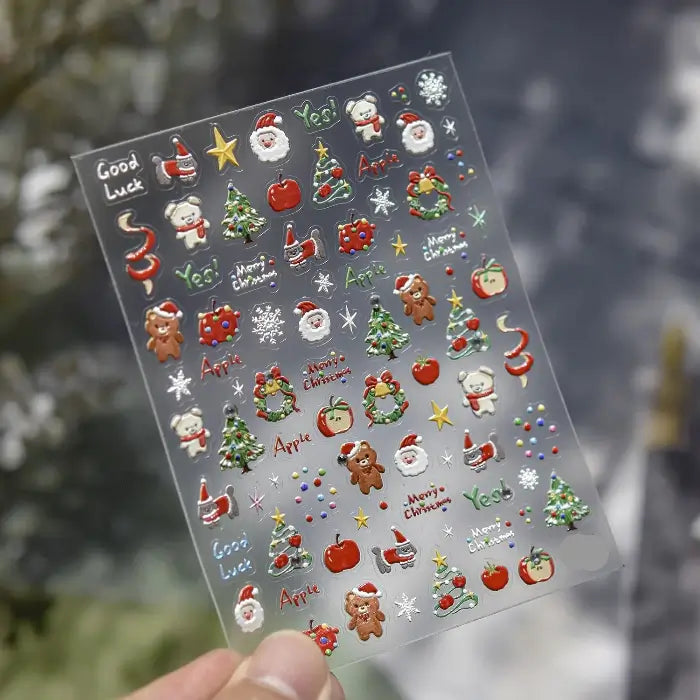 Planche de stickers ongles avec visages de Père Noël, oursons, pommes et couronnes