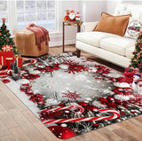 Tapis à bordure de boules et flocons rouges et gris sur fond gris, posé au salon près d'un canapé