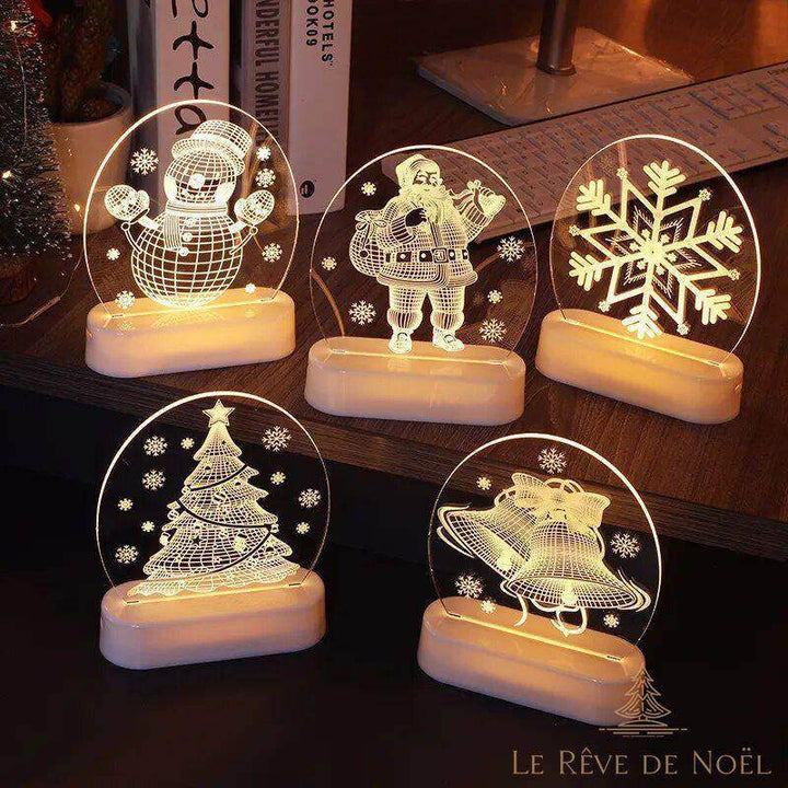 Cinq veilleuses rondes allumées à motifs différents : bonhomme de neige, père Noël, flocon, cloches