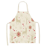 Tablier de Noël écru à motif répété de rennes beiges, étoiles rouges et flocons géométriques