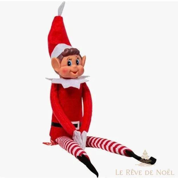 Lutin rouge assis jambes tendues, jambières rayées rouge et blanc