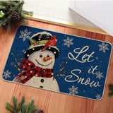 Tapis d'entrée bleu nuit, bonhomme de neige avec cardinal rouge sur le chapeau, texte Let it snow