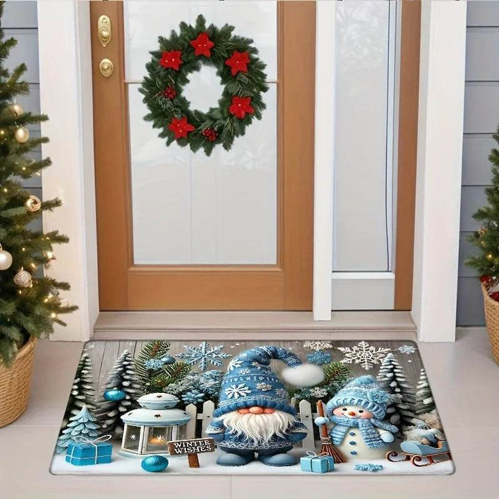 Vue large de l'entrée : tapis bleu au sol, couronne de Noël sur la porte, sapins de chaque côté