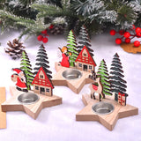 Trois bougeoirs étoile en bois avec coupelle métallique, figurines Père Noël, ange et renne, sur neige