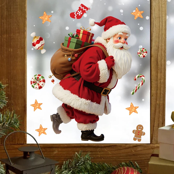 Stickers Père Noël et friandises collés sur une fenêtre en bois, neige visible derrière la vitre