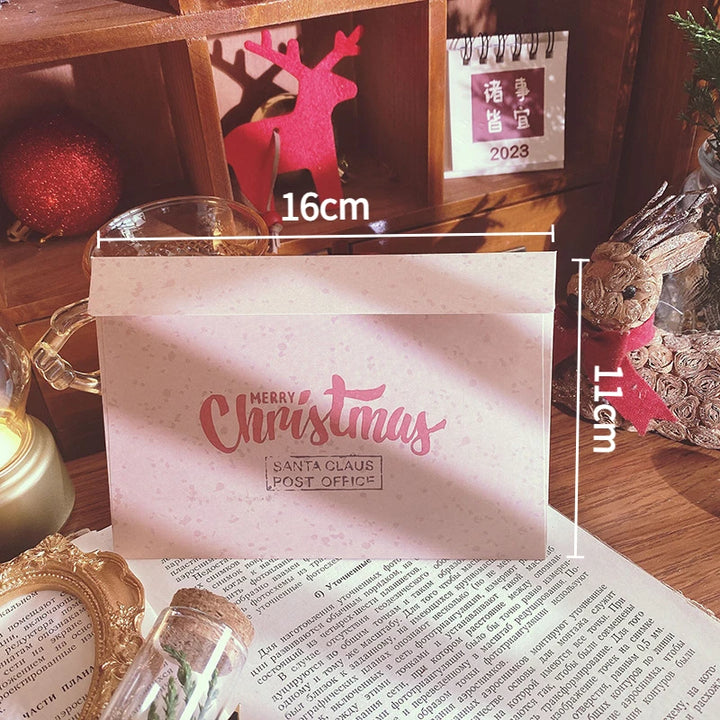 Schéma des dimensions de l'enveloppe Père Noël : 16 cm de large sur 11 cm de haut