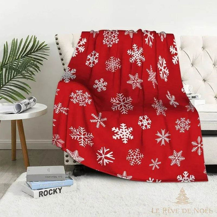Plaid de Noël rouge entièrement recouvert de flocons de neige blancs