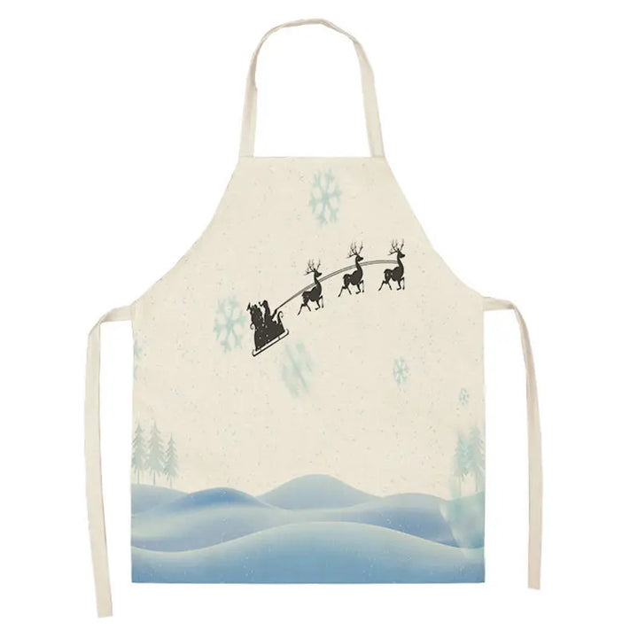 Tablier de Noël avec traîneau et rennes en silhouette noire survolant des collines enneigées