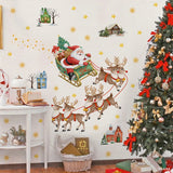 Stickers traîneau du Père Noël au mur, à côté d'un sapin décoré de nœuds rouges