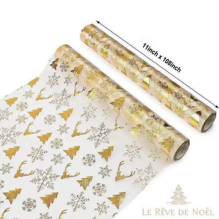Chemin de table de Noël à motifs dorés de rennes et sapins, deux rouleaux partiellement déroulés