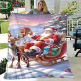 Plaid de Noël motif traîneau : Père Noël assis, cadeau en main, à côté d'un renne attelé