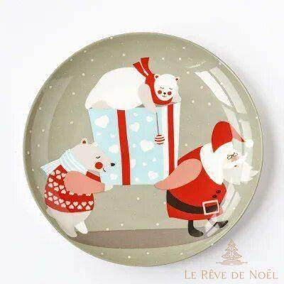 Sous-assiette grise montrant un Père Noël portant un cadeau entouré de deux oursons