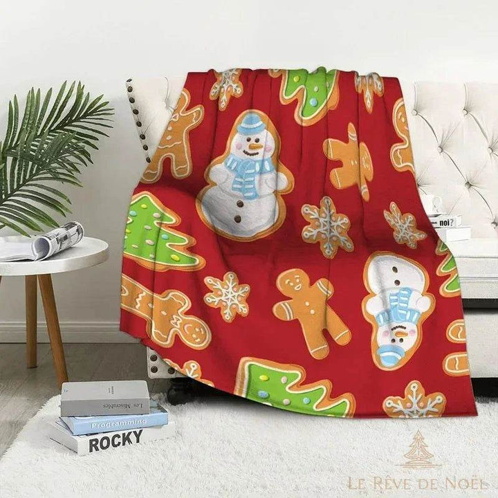 Plaid de Noël rouge façon biscuits glacés : bonhomme de neige, sapin et flocons