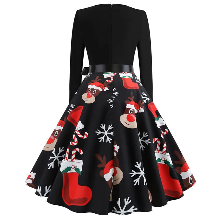 Dos de la robe noire avec fermeture éclair visible, jupe à motif de rennes et chaussettes de Noël