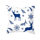 Housse de coussin blanche à motif de rennes bleus debout et bondissants parmi des flocons