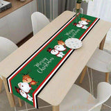 Chemin de table vert à motif rennes et bonhomme de neige avec texte Merry Christmas, sur la même table en bois