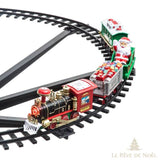 Gros plan sur la locomotive et les wagons cadeaux et traîneau du Père Noël sur le rail entrecroisé