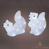 Deux écureuils en acrylique blanc à LED intégrées, assis face à face, sur fond uni