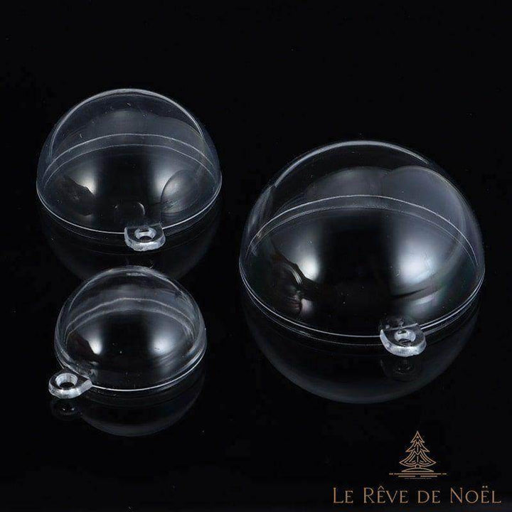 Boules transparentes ouvertes montrant leurs deux moitiés emboîtables et anneau d'attache