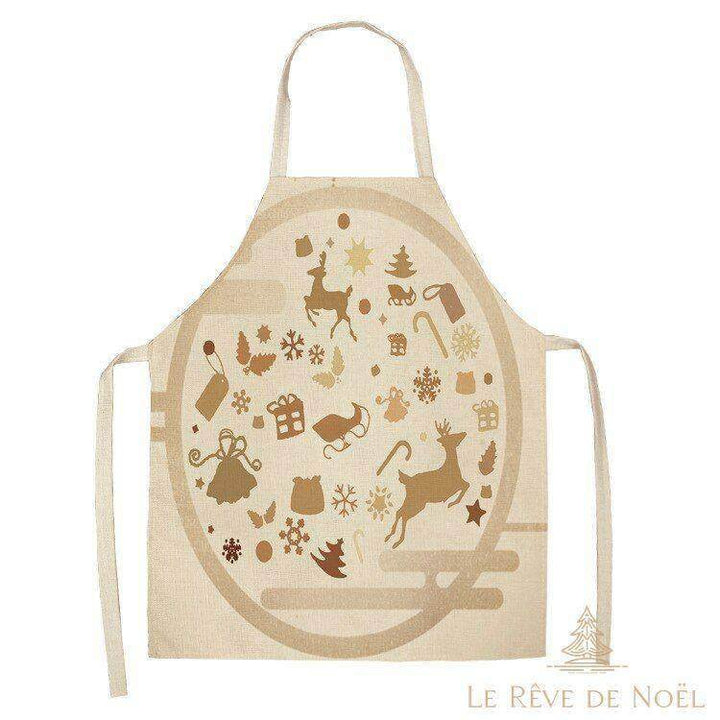 Tablier de cuisine beige avec motifs de Noël (rennes, traîneau, sapins) en cercle, vu de face
