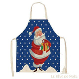 Tablier de cuisine bleu à pois blancs, illustration d'un Père Noël souriant tenant un cadeau